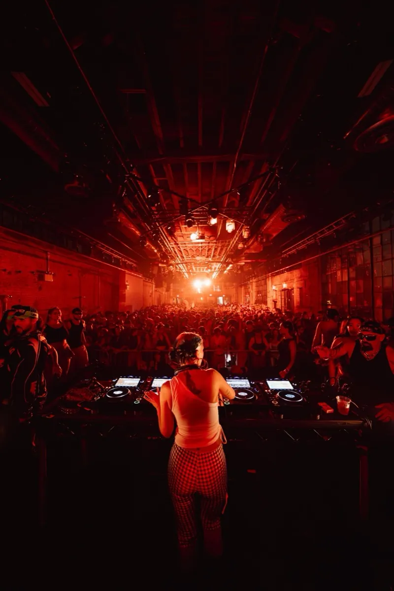 Crowd at a previous ÄGAPĒ warehouse event in Brooklyn